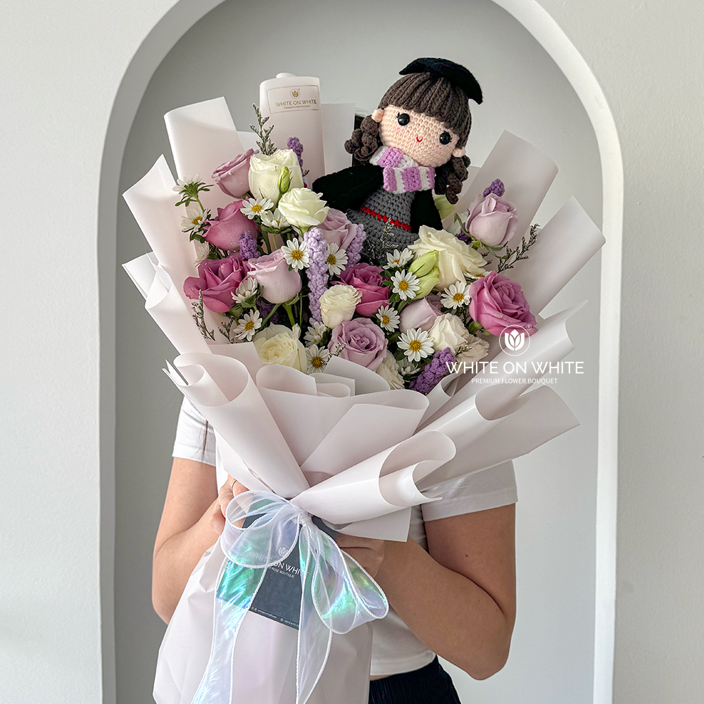 Purple rose with white eustoma bouquet with graduation knitted girl doll