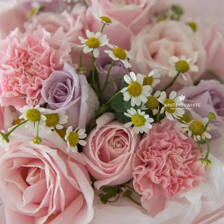 Soft pink roses and white daisies bouquet for special occasions.