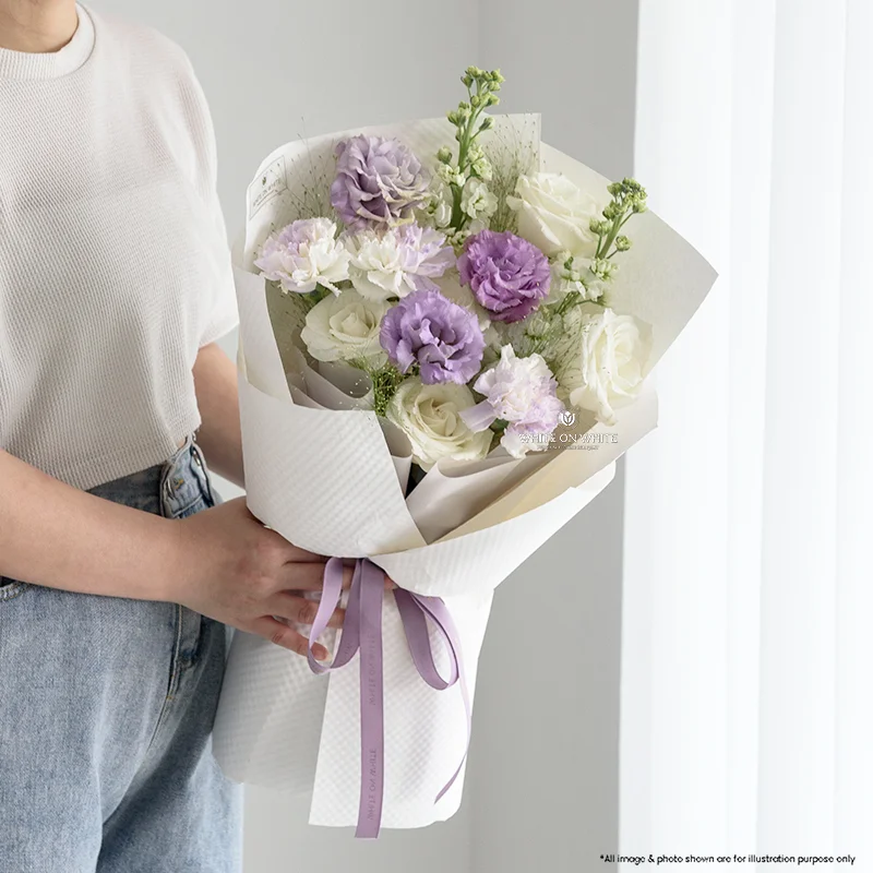 Lilac Bloom Bouquet featuring white roses, purple eustoma, and tinted carnations wrapped in white paper, available for same day delivery Singapore