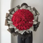 Be My Love Bouquet featuring a giant arrangement of premium red roses wrapped in black paper, available for same day delivery Singapore
